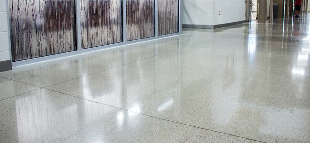 Polished concrete floor with expansion joints filled.