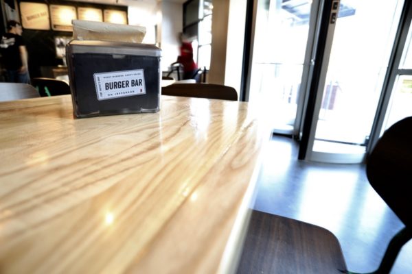 Wood grain table with a napkin dispenser