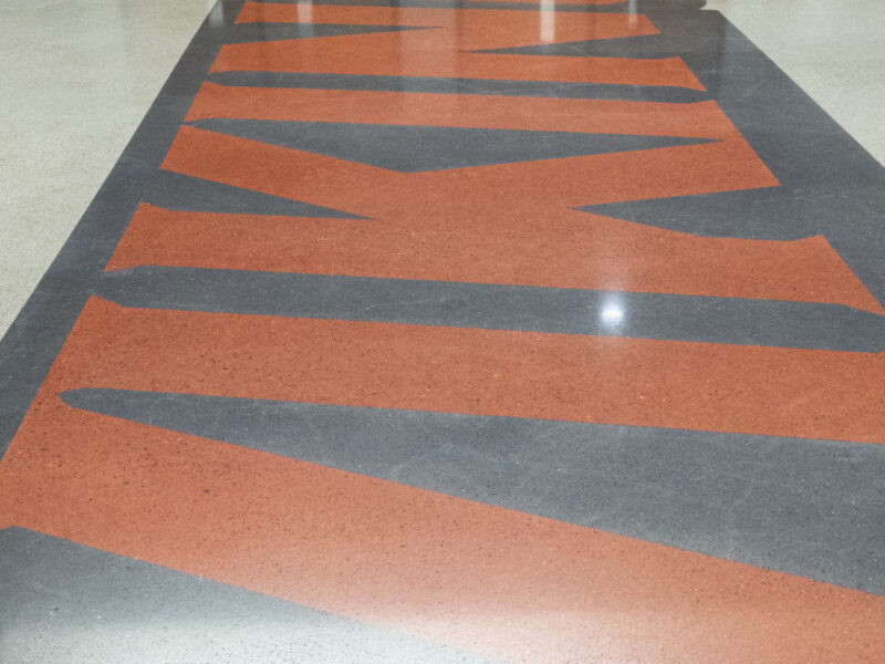 DANCER Polished Concrete with Dyed Logos at Huntington North High School