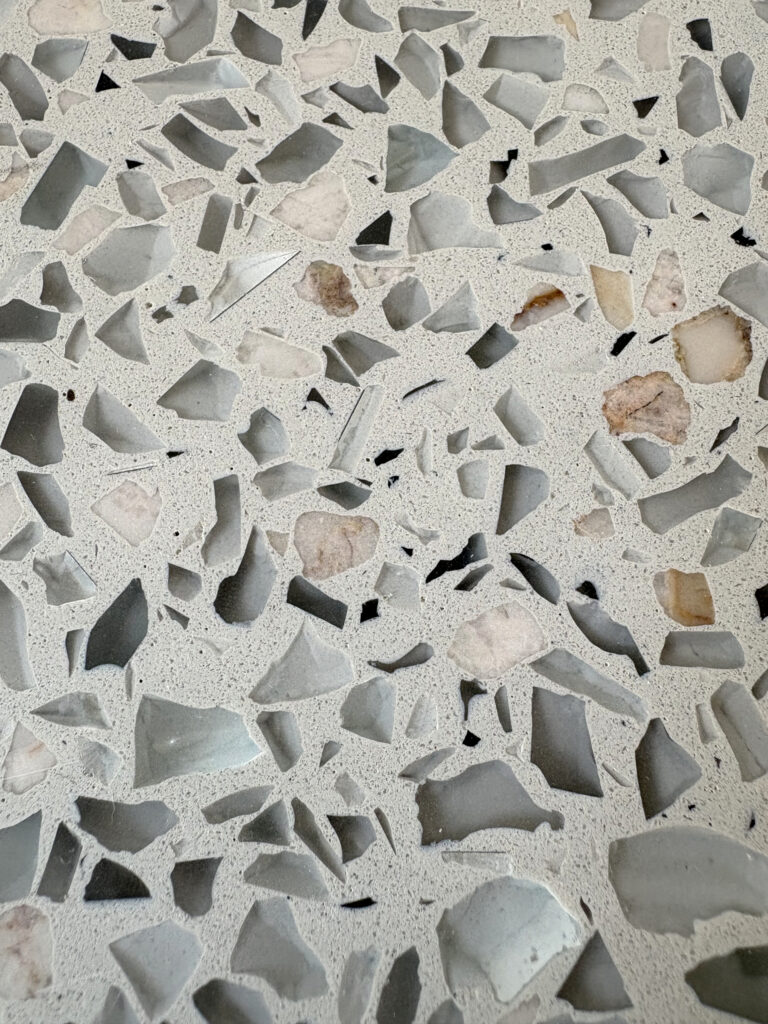 Faint speckle of marble dust within the matrix of epoxy terrazzo